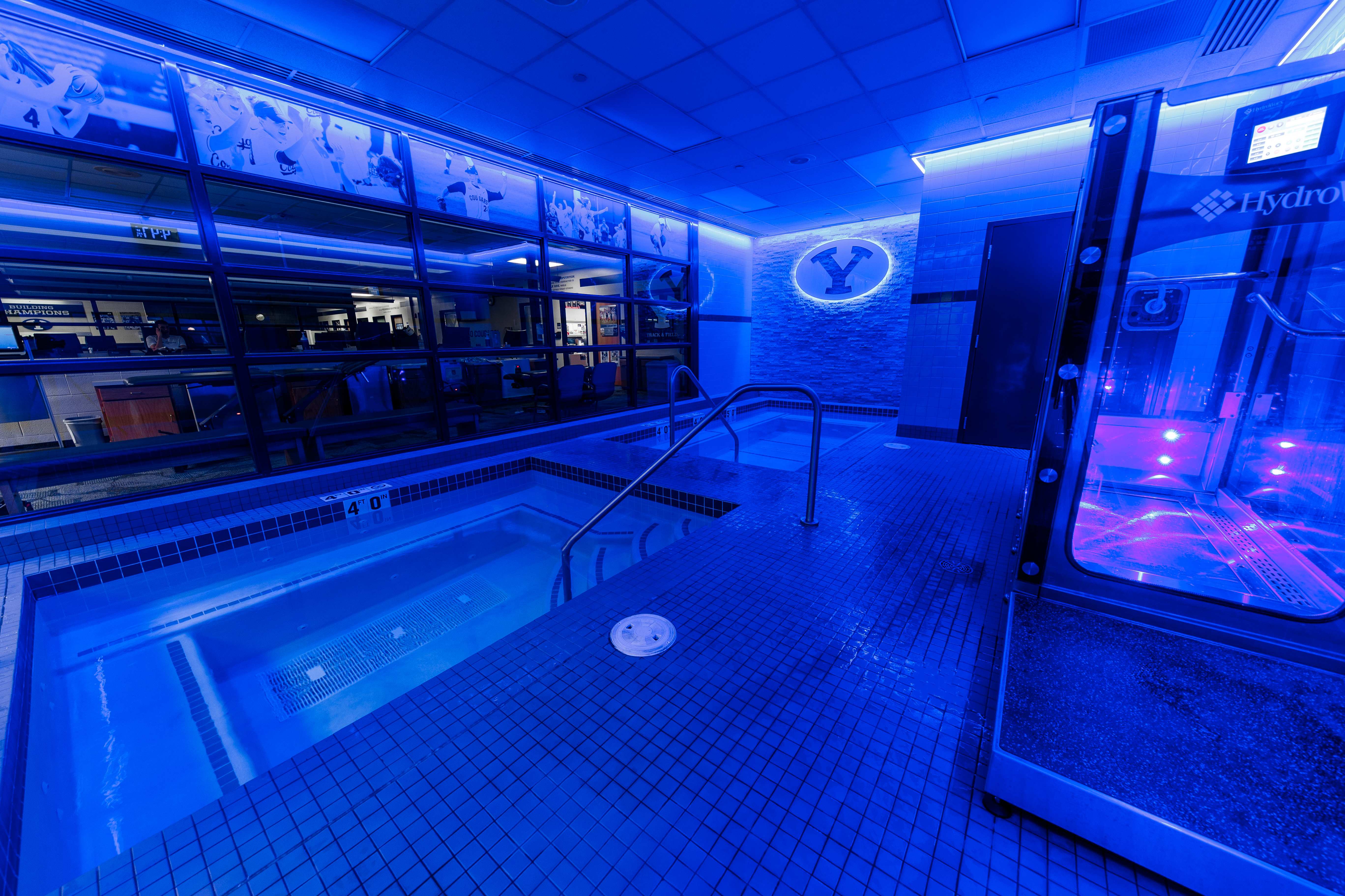 Therapy pool facility with neon lights lit