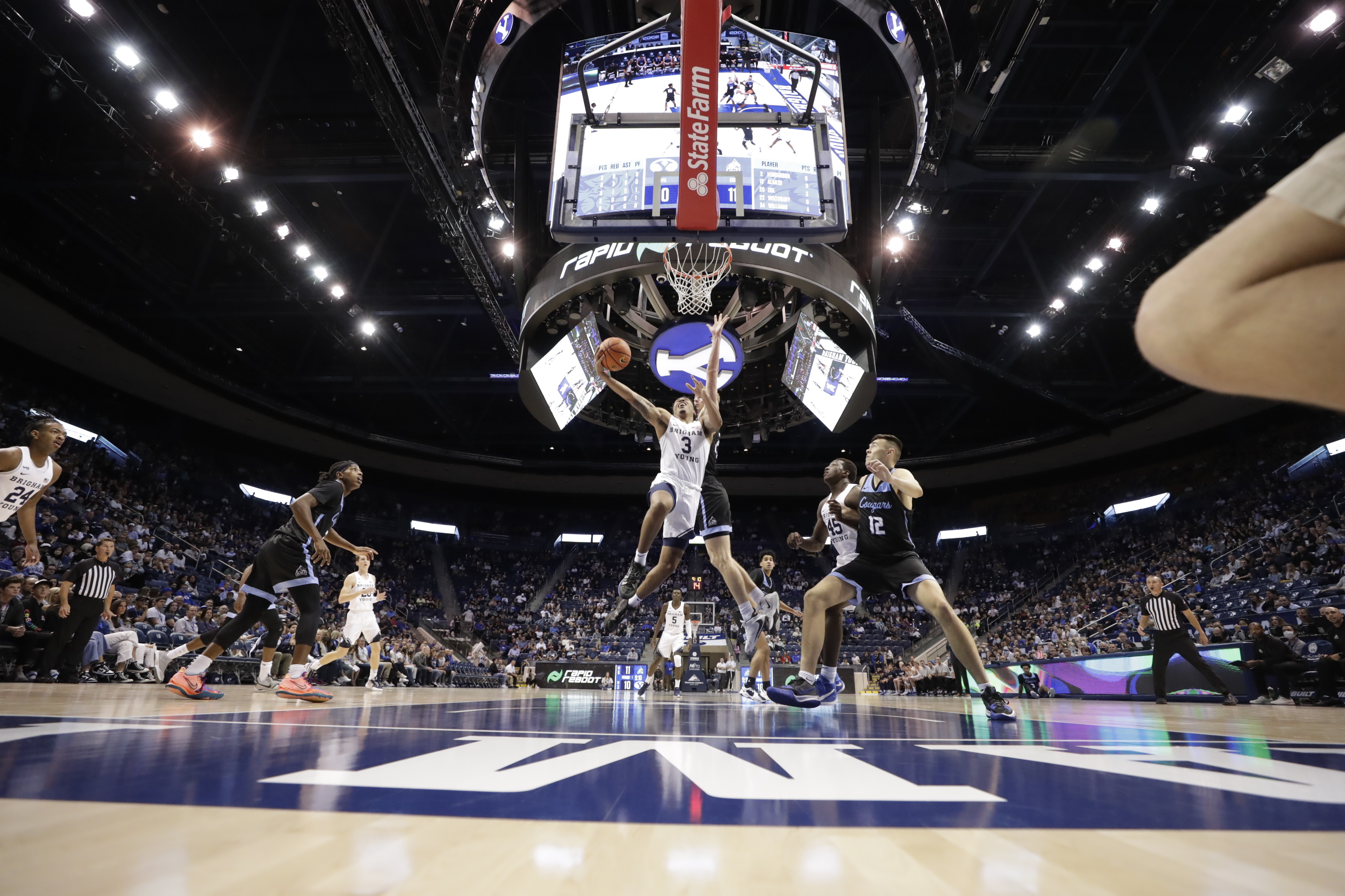 BYU men's basketball player Te'Jon Lucas drives in for a layup in the Cougars 63-45 victory over Colorado Christian University.