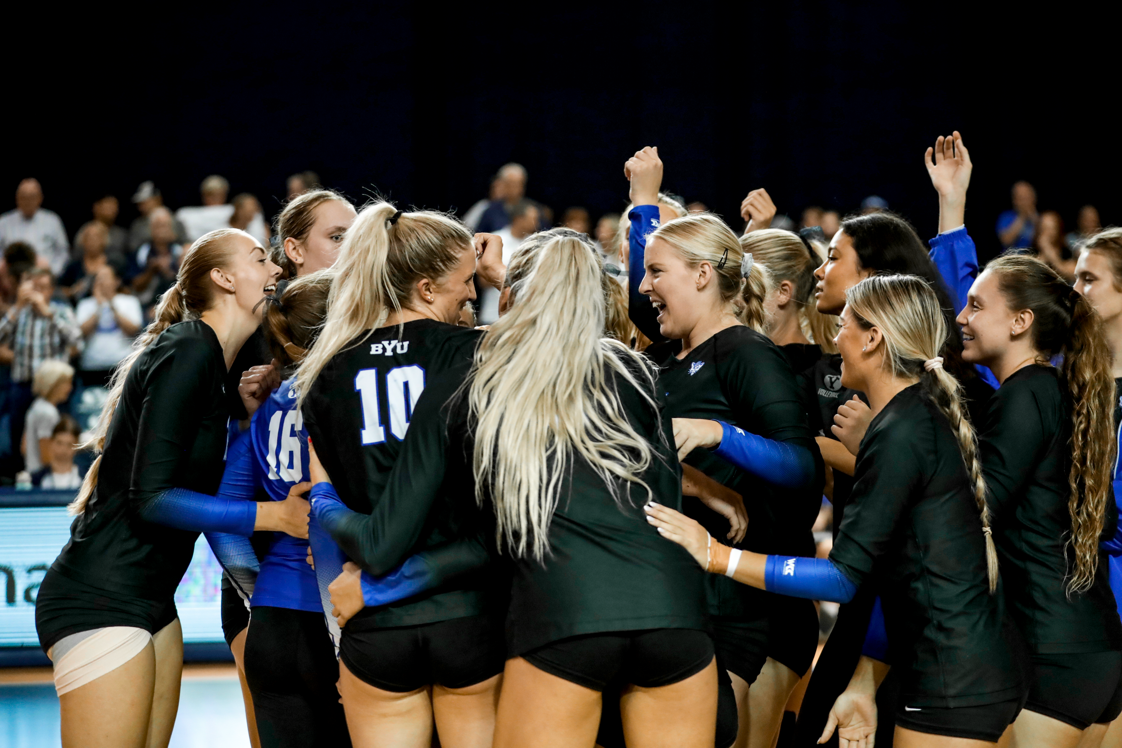 BYU women's volleyball celebrates a 3-1 win over Cincinnati.