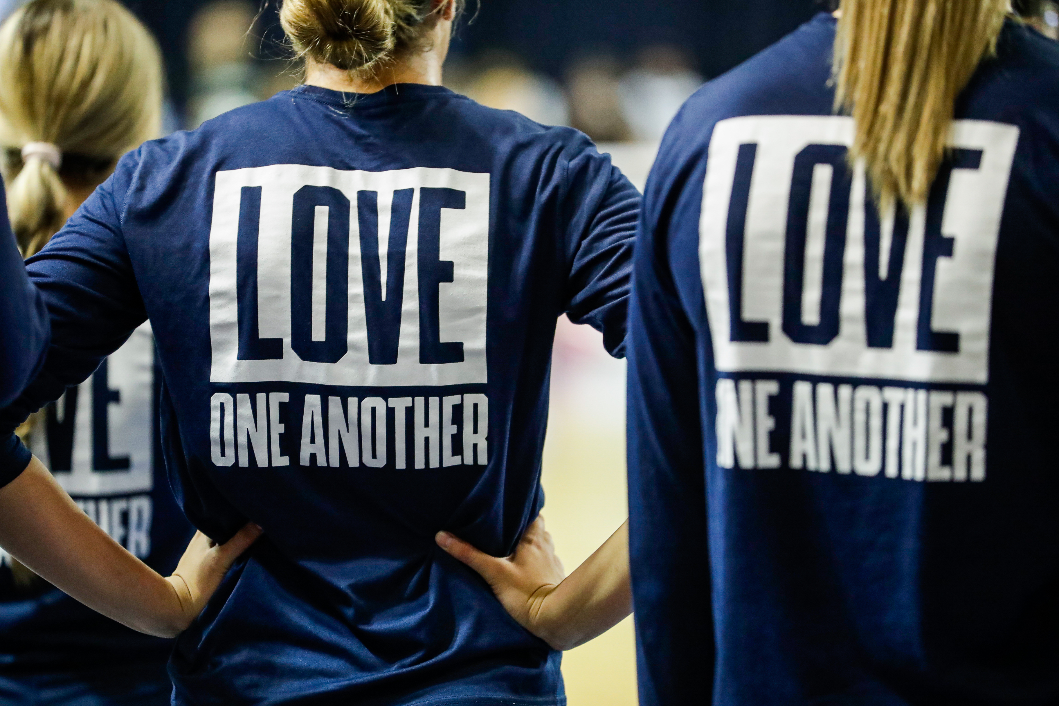 2022 BYU women's volleyball wearing "Love One Another" shirts pre-game 