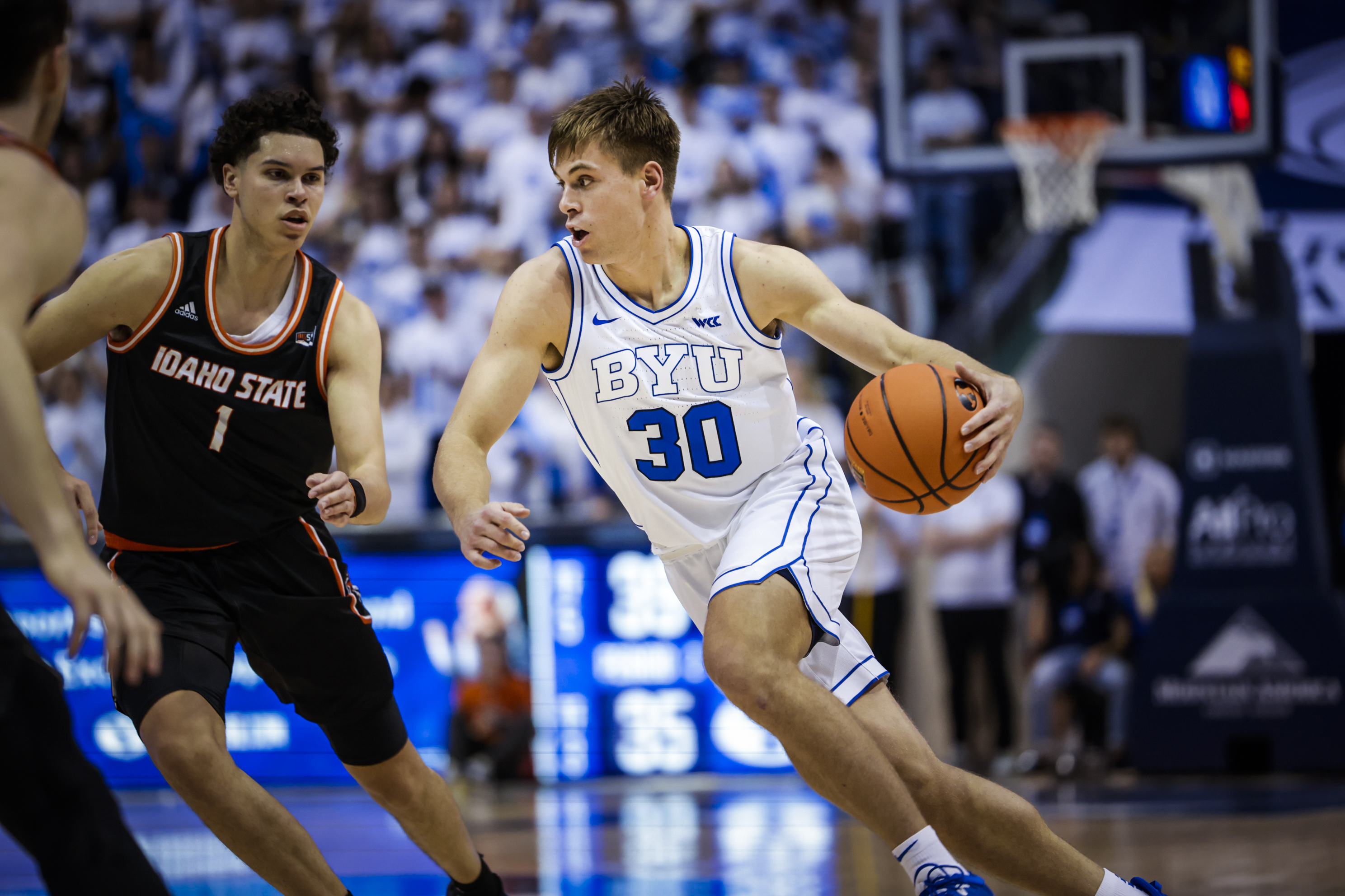 Dallin Hall dribbles to the basket during a game against Idaho State at the Marriott Center.