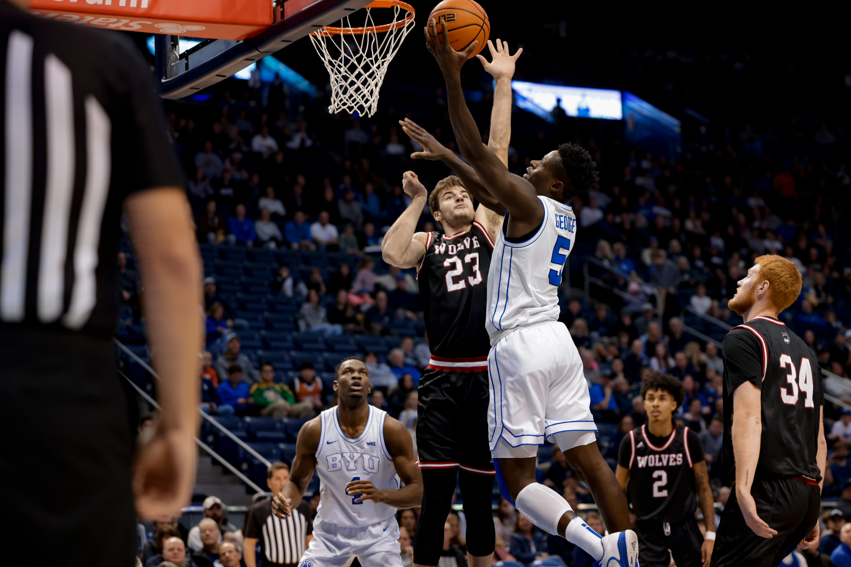 Gideon George lays it up during a game against Western Oregon at the Marriott Center.