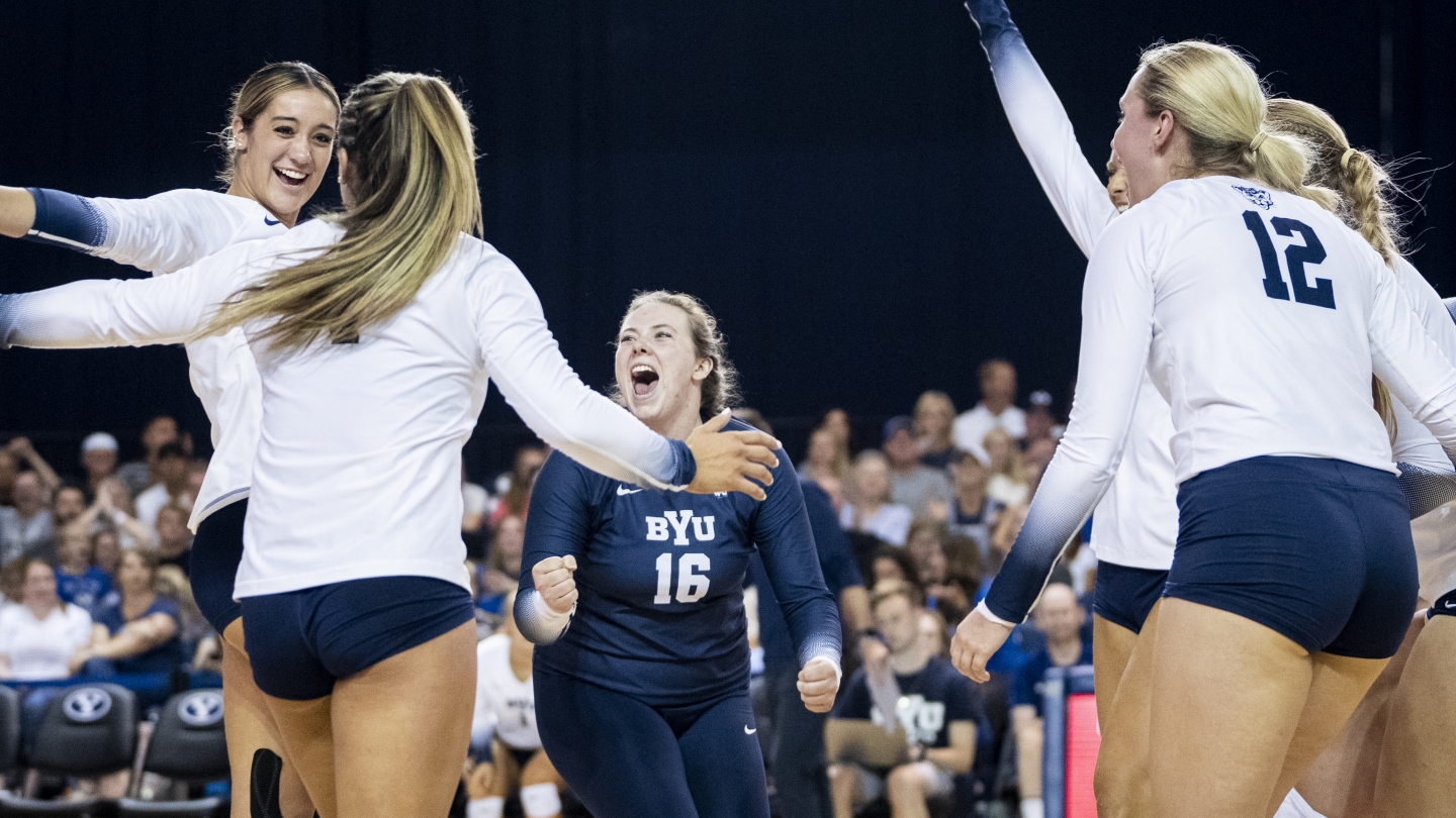 Alyssa Montoya, Whitney Bower, Kelsey Knudsen and Kate Grimmer after a point against Utah State