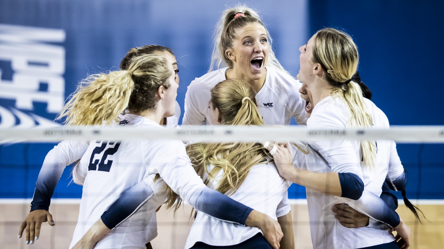 Erin Livingston celebrates with No. 14 women's volleyball in-between points against San Francisco