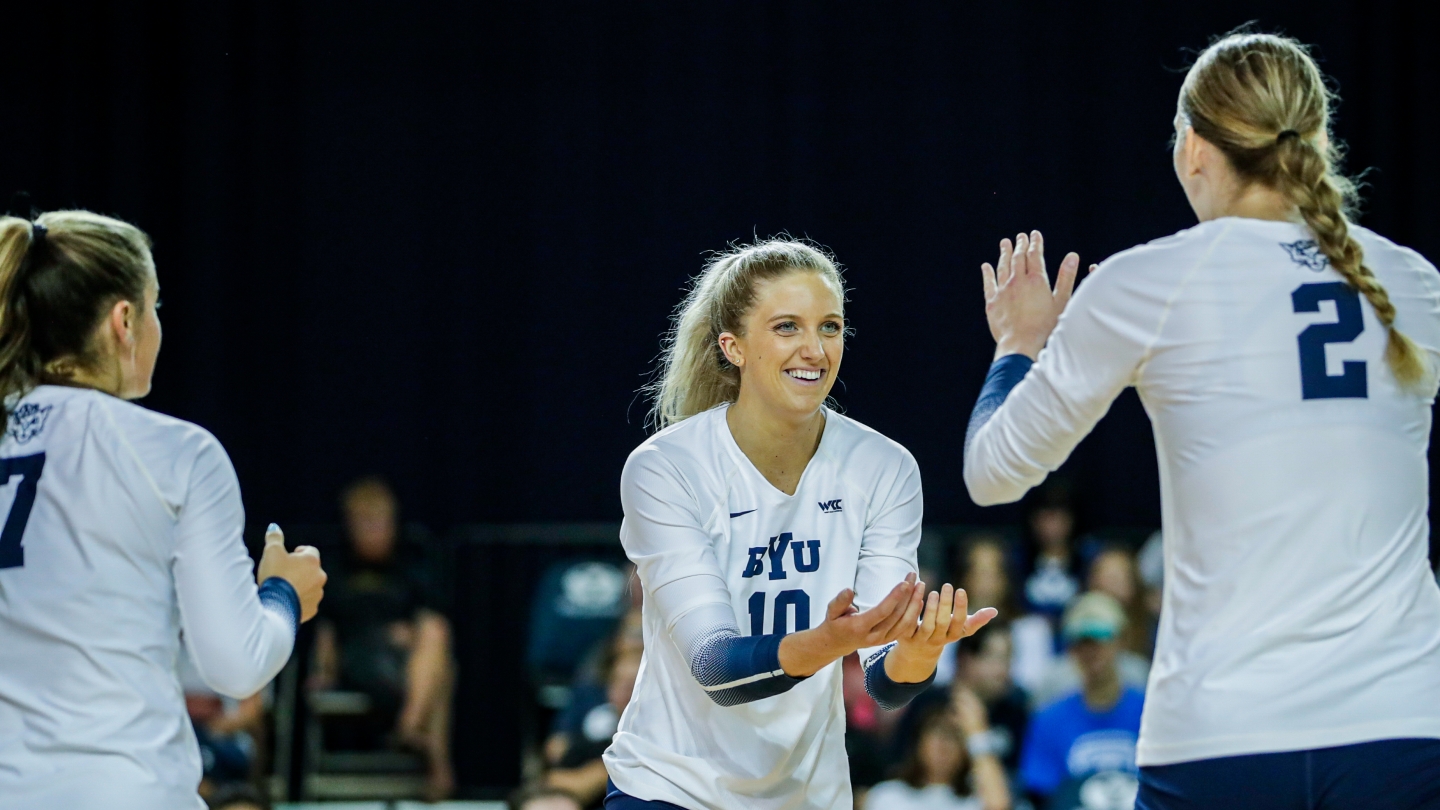 Erin Livingston high-fives Heather Gneiting during No. 14 BYU's sweep of San Francisco