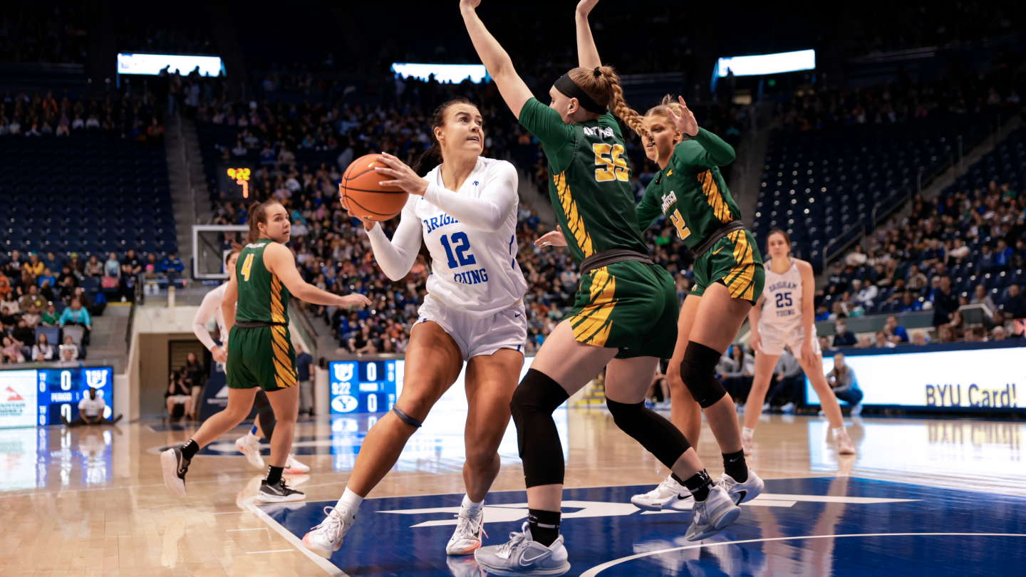 Lauren Gustin scores over a San Francisco defender during a 78-59 win over the Dons at the Marriott Center.