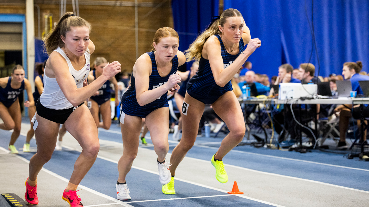 Allie Warner and Madi Moffitt compete at BYU's January 2023 indoor track and field home meet.