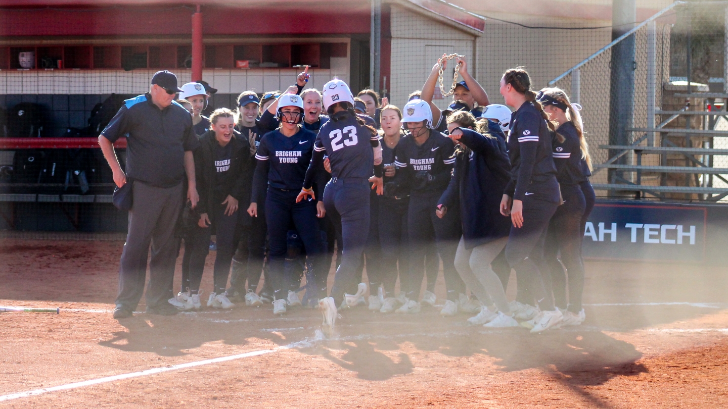 Violet Zavodniks touches home in front of a celebrating BYU softball team after homering against UNLV in the Trailblazer Tournament on Friday, March 3, 2023