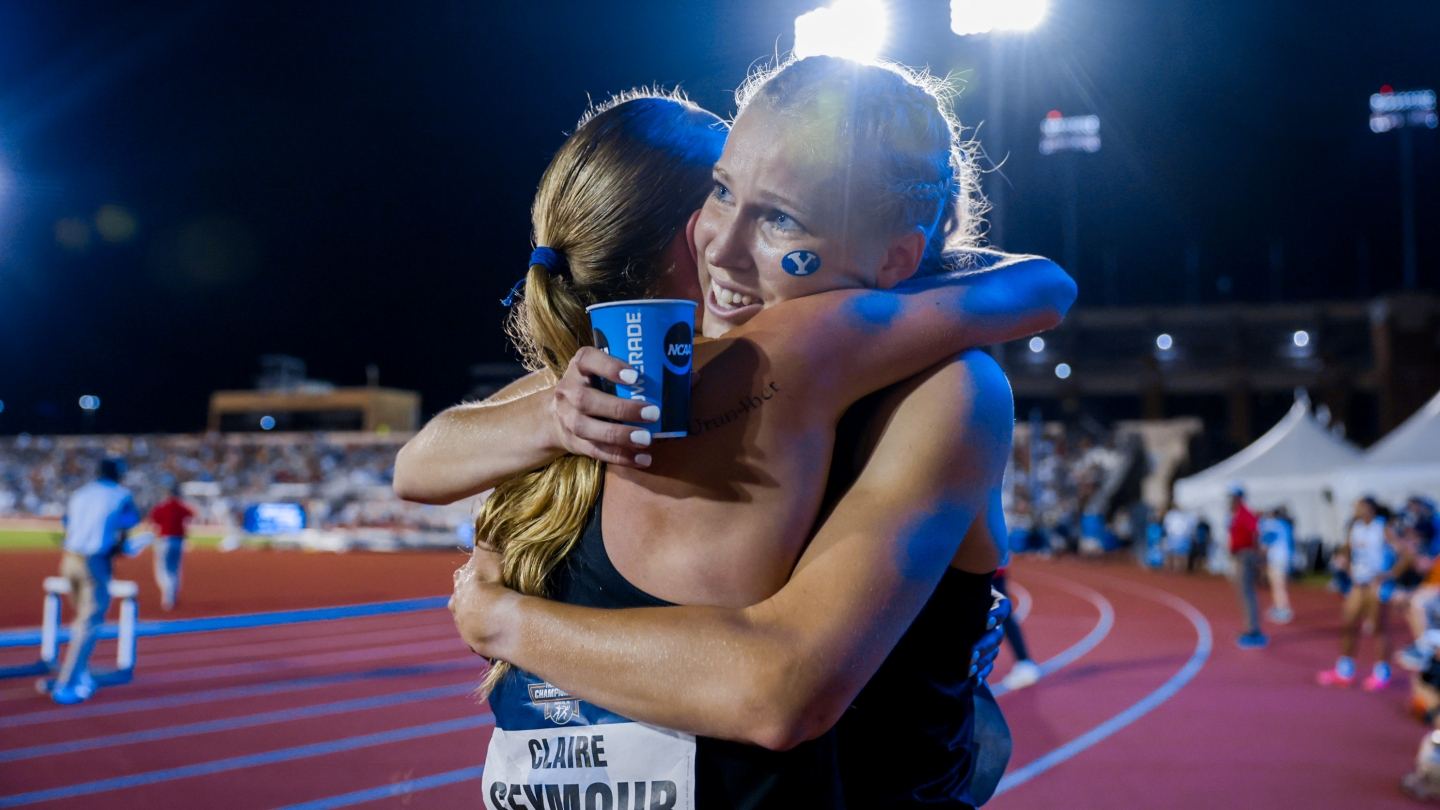Claire Seymour and Meghan Hunter hug after both advance to 800m semifinal