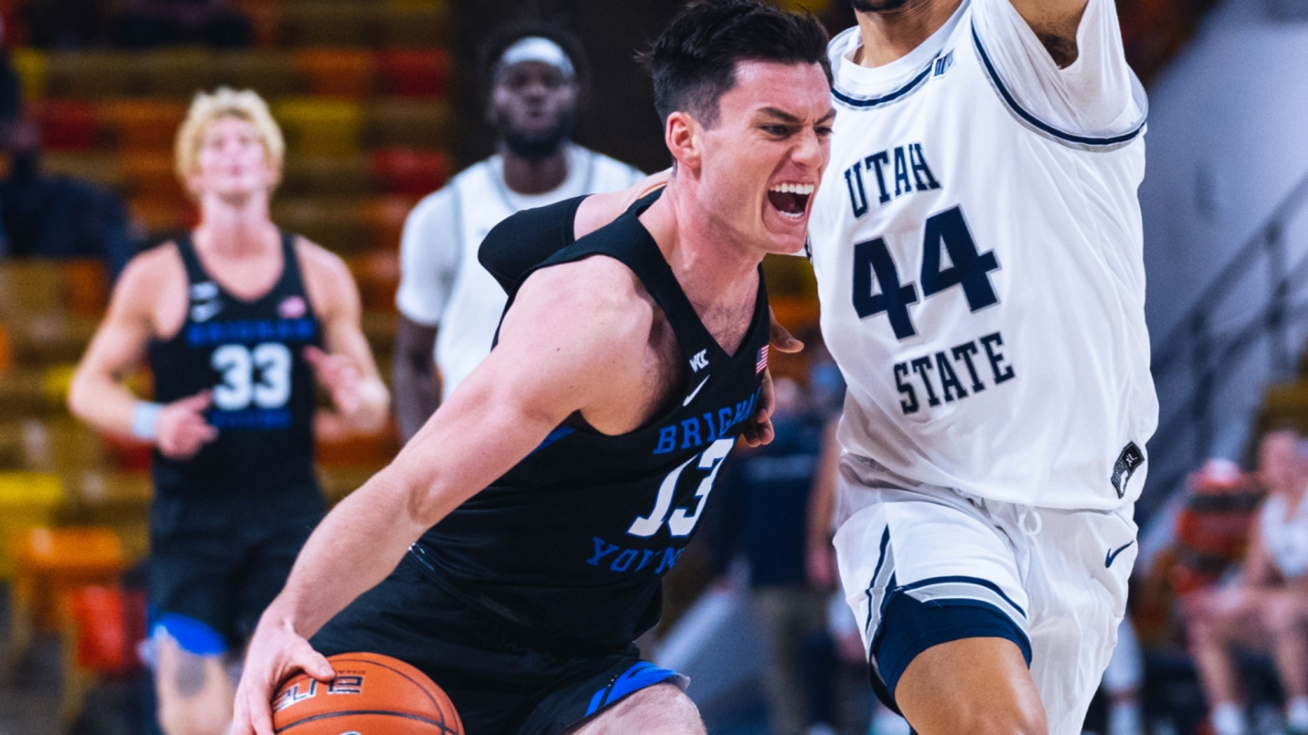 Alex Barcello driving with the basketball against Utah State