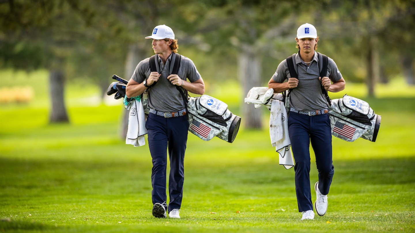 Tyson Shelley and Carson Lundell walk down the fairway at Riverside Country Club.